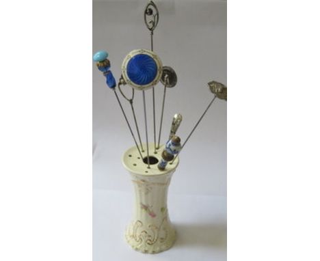 CERAMIC HAT PIN STAND AND EIGHT HAT PINS INCLUDING ONE BY CHARLES HORNER PLUS ONE SILVER AND GOUACHE ENAMELLED, INITIALLED 'L