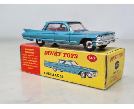 A boxed Dinky Toys No.147 Cadillac 62 with red interiors, M, box Ex plus