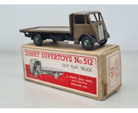 A boxed Dinky Toys No.512 light brown Guy Flat Truck with green hubs, Nr M, box VG