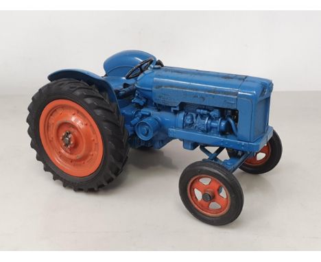 An unboxed Chad Valley Fordson Major Tractor, good condition with moderate wear, all parts in place