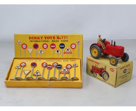 A boxed Dinky Toys No.300 Massey-Harris Tractor, Ex, box Ex, and a boxed No.771 International Road Signs Set, VG, box G