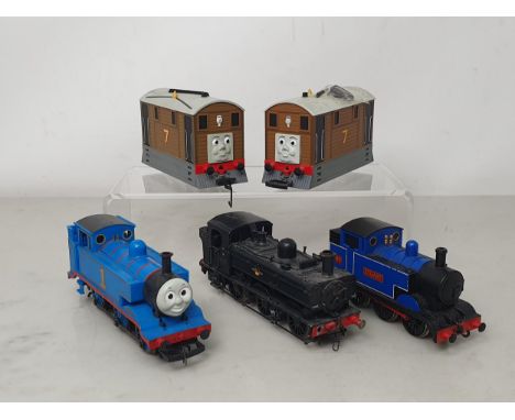 Five unboxed Hornby and Bachmann 00 gauge Locomotives including Thomas the Tank, two Toby the Trams, a DCC ready 0-6-0T 'Stua