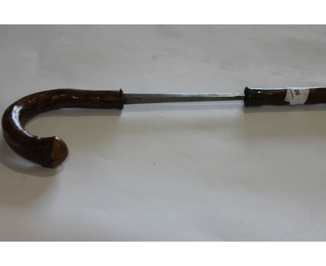 A GENTLEMANS SWORDSTICK. A Gentlemans Swordstick in cane and silver mounts, hallmarks for R & S of London. Heavy tapering dia