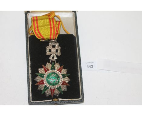 A CASED ORDER OF GLORY A Commander (Neck Badge) of the Tunisian Order of Glory 'Nichan Iftikhar', unnamed as issued in its or