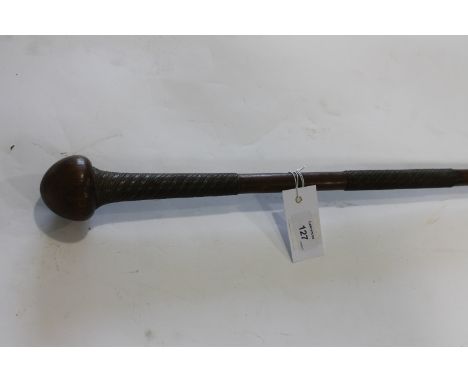 A KNOBKERRIE. A native fighting stick in Knobkerrie form with wire wrap decoration, in the Zulu style. 34.1/2" overall length