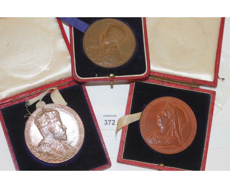 THREE CASED BRONZE MEDALLIONS. The first an 1897 Diamond Jubilee 55 mm diameter. The second a 1902 Coronation Medal 55mm diam