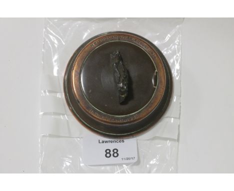 A HELIOGOLAND BIGHT 28/8/1914 SOUVENIR OF HMS FEARLESS. A naval desktop souvenir made form a shell casing with a piece of mou