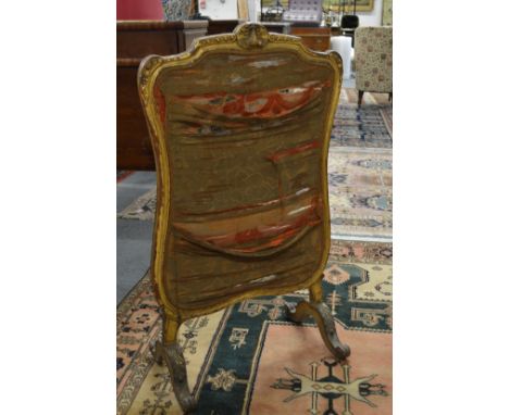 A carved gilt framed fire screen.