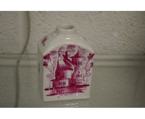An early puce decorated pottery tea caddy.