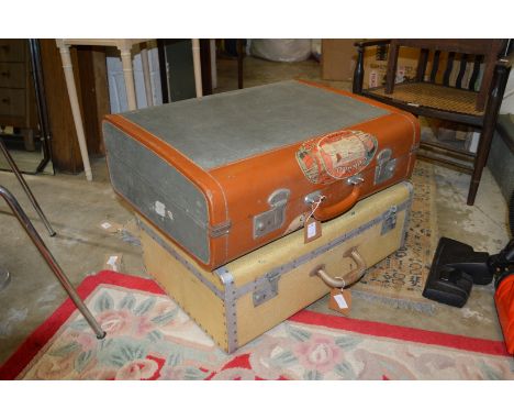 Two vintage suitcases.