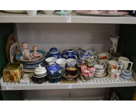 A shelf of decorative china.