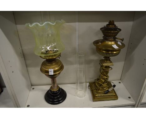A Victorian oil lamp and another converted to electricity.