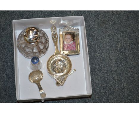 A collection of small silver ware to include a caddy spoon.