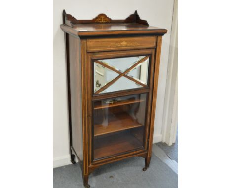 A Victorian rosewood and inlaid music cabinet.