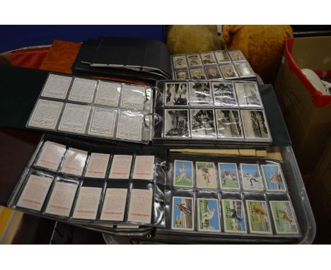 A large quantity of cigarette cards, mostly in albums.