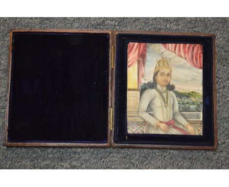 A 19th century Indian miniature portrait in a leather case.