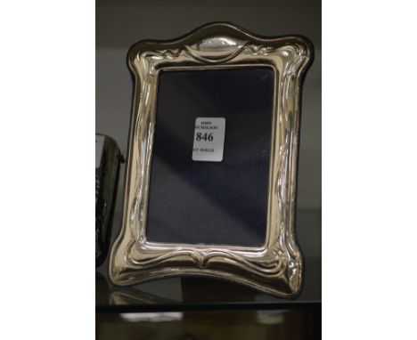An Art Nouveau silver photograph frame.