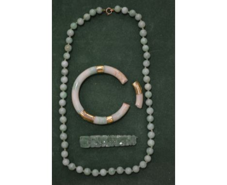 A Chinese jade bead necklace and similar items.