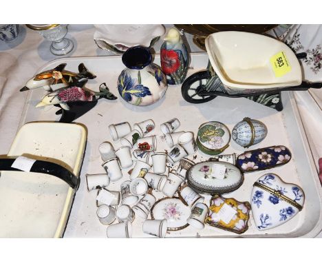 A collection of china thimbles, enamel miniature boxes etc 
