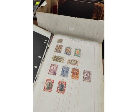 An interesting vintage collection of British Colonial and world stamps contained in two ledgers, 2 other albums 