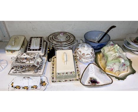 A collection of ceramic cheese, butter and other similar dishes and china 