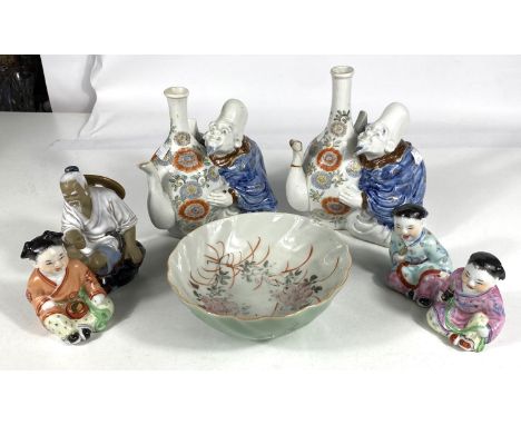 A selection of 20th century Chinese ceramic figures and a similar bowl; a pair of unusual Chinese teapots in form of men sitt