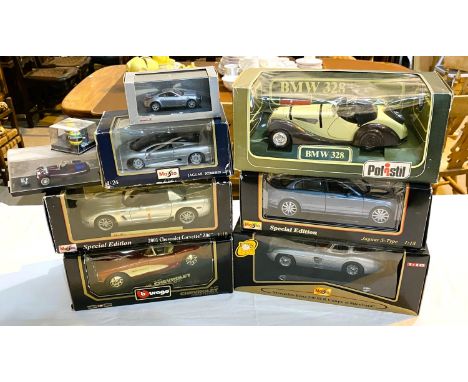 Six boxed larger scale car models: Two Maisto special editions; Jaguar S-Type and Chevrolet Corvette, Burago Chevrolet, Polis