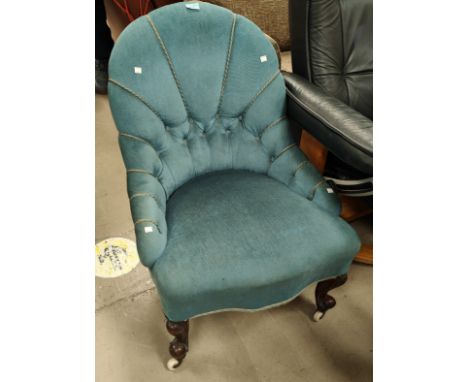 A Victorian nursing chair on knurled legs, blue button back upholstery 