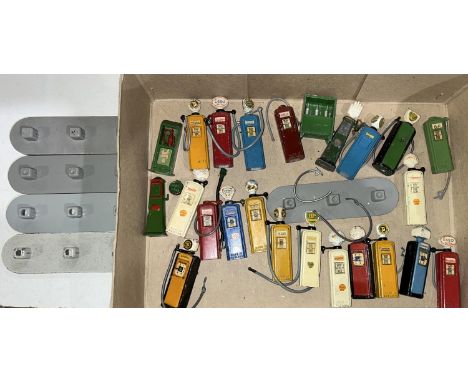 A collection of diecast vintage petrol pumps and stands for Esso, Shell and BP etc 