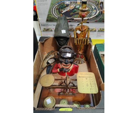A set of postage scales and weights; a "Black Boy" money box and decorative items 