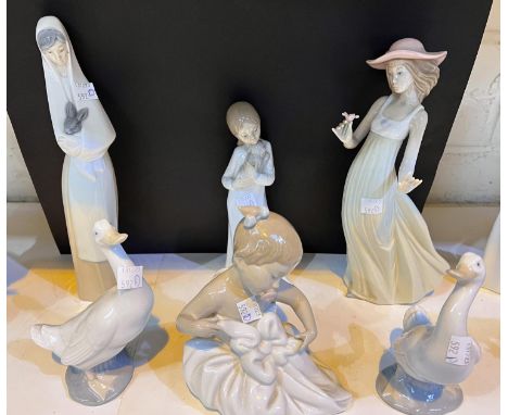 A Nao figure of a baby, three Nao figures of ladies and two geese 