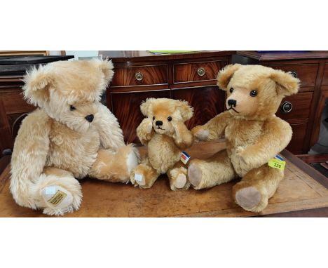 A Merrythought limited edition bear, 34/1500, with moving tail, length 48cm; a Dean's bear with growl, length 40cm; another D