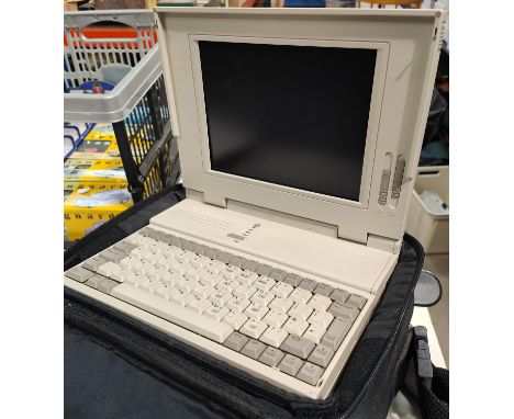 A vintage computer COMPAQ LTE 386s/20 in case with cable, mouse mat, etc. (corner of case cracked) 
