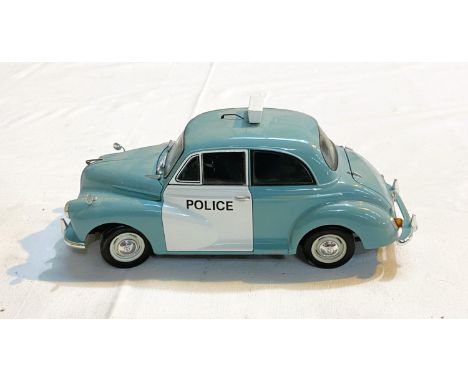 A Minichamp 1:18 scale diecast model of a Morris Minor Traveller, box; a Minichamp 1:18 scale Morris Minor Police Car with bo