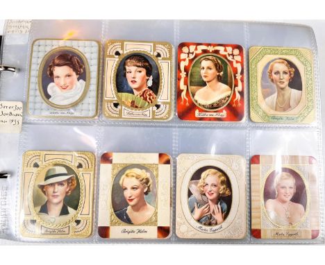 An album of film star and other cigarette cards:&nbsp; Garbacz c. 1935, complete set of 300; another similar set of 300 