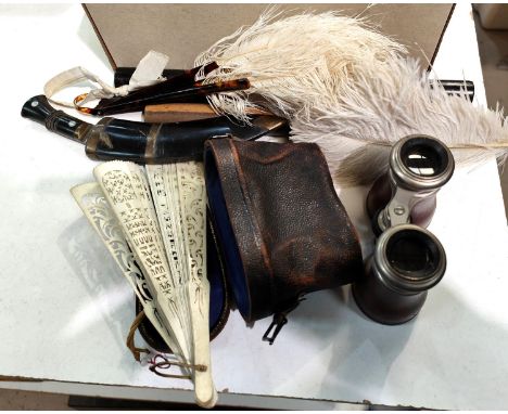 An Ostrich feather and tortoiseshell stick fan, a bone fan with pierced sticks, a pair of Racing glasses, Minolta binoculars 