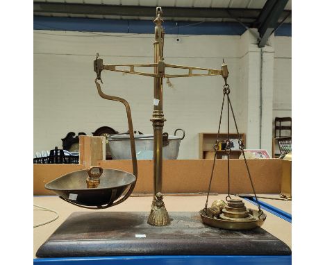 A brass balance scale and weights&nbsp; 