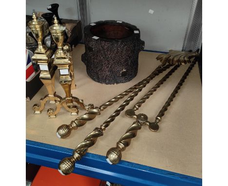 A 19th century set of brass rope twist fire irons and dogs; an unusual rustic planter in the form of a tree trunk 