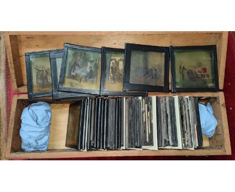 A selection of vintage glass lantern slides in wooden box 