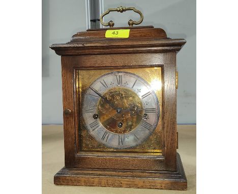 A Georgia style bracket clock in oak case with brass dial and chiming movement 