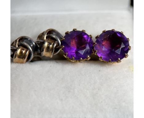 A pair of 9 ct. stud earrings set with amethyst coloured stones and a pair of Turks head stud earrings. 