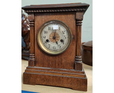An Edwardian architectural oak cased striking mantle&nbsp; clock 