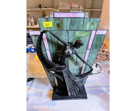 An Art Deco style bronzed table lamp:&nbsp; Dancing Lady, with coloured and leaded glass shade 