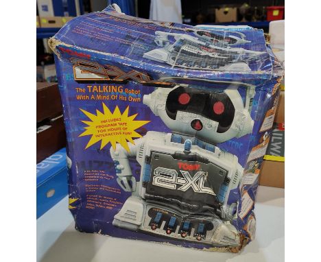 A Tomy 2-XL robot in original box with instructions and cassette tape; a Monopoly boxed game:&nbsp; Special Commemorative Ann