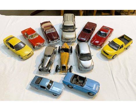 A collection of larger scale car models, including a Rico Lamborghini etc.&nbsp; 12 approximately. 