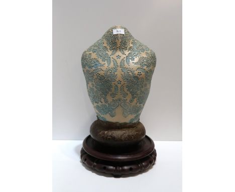 A ceramic bust with impressed blue floral decoration, with a modelled brown base, upon a hardwood stand, 48cm Condition Repor