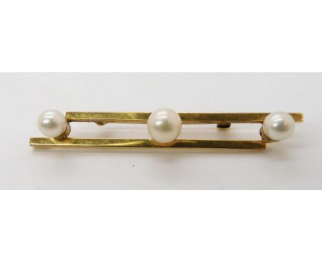 A 9ct gold three pearl brooch, length 6cm, weight 7.4gms Condition Report:Available upon request