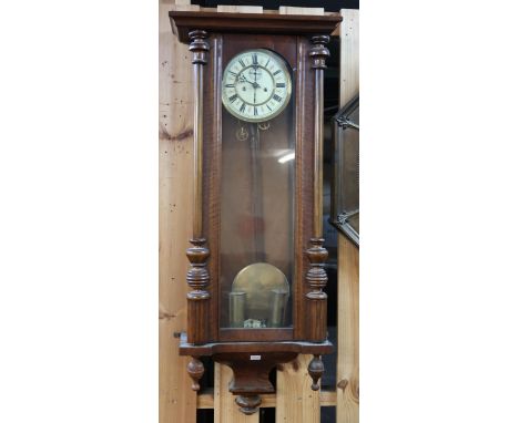 A 20th century mahogany cased Vienna style wall clock and an oak cased mantle clock (2) Condition Report:Available upon reque