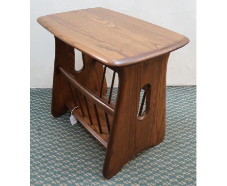 A contemporary Ercol elm and beech magazine stand Condition Report:Available upon request