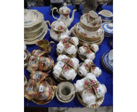 A Royal Albert Old Country Roses dinner and tea service including teapot, coffee pot, plates, bowls, cups, saucers and side p